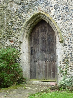 Ancient wooden doorway into Mickfield Church