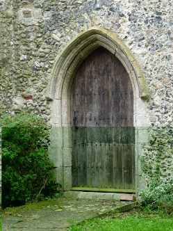 Ancient wooden doorway into Mickfield Church